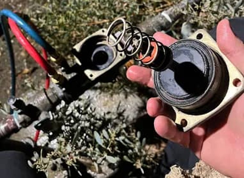 Damaged backflow parts removed for repair